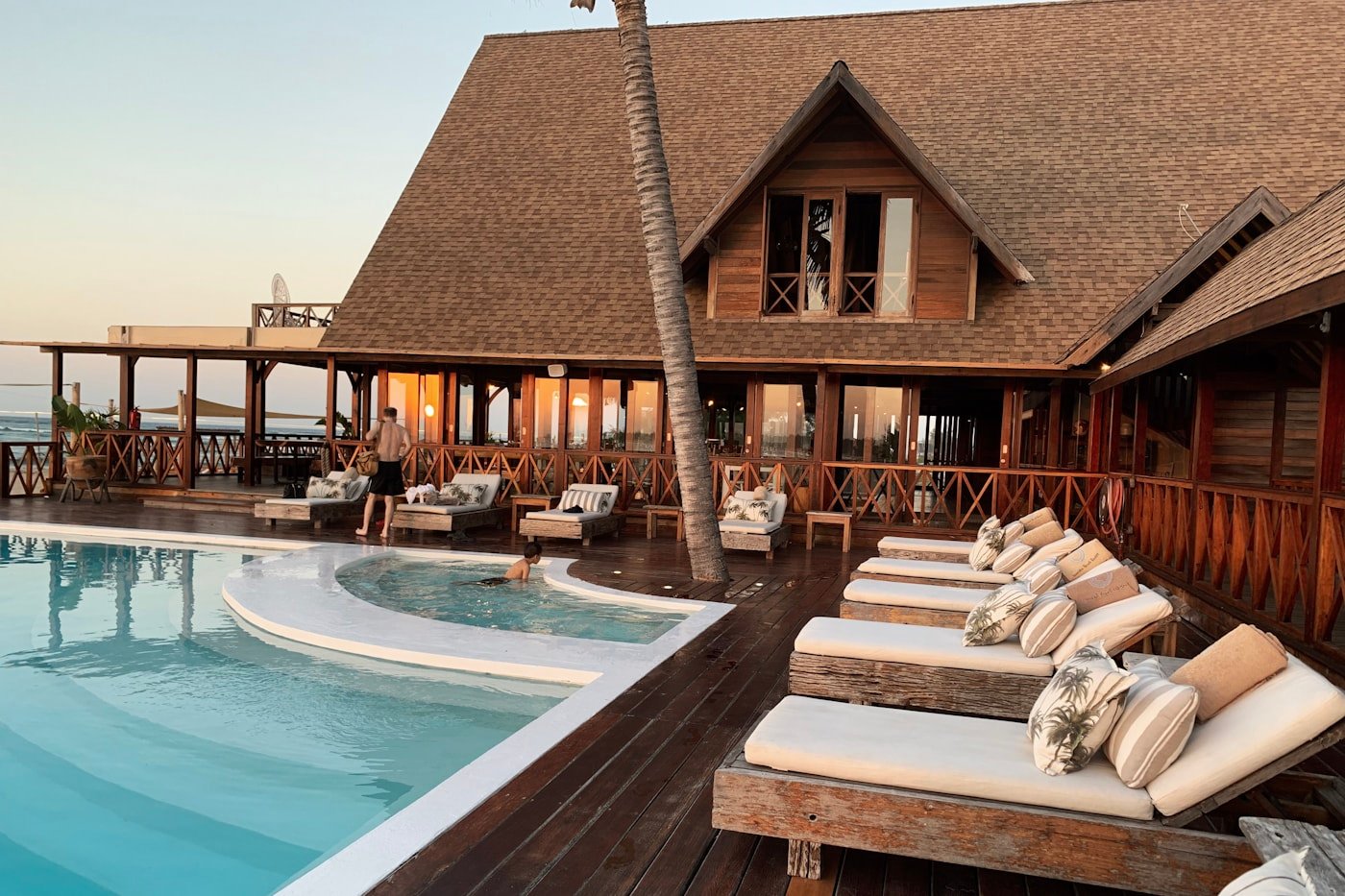 Resort pool and oceanfront member travel setting